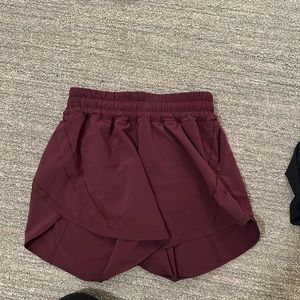 Lululemon track that short, 5 in in a magenta purple color